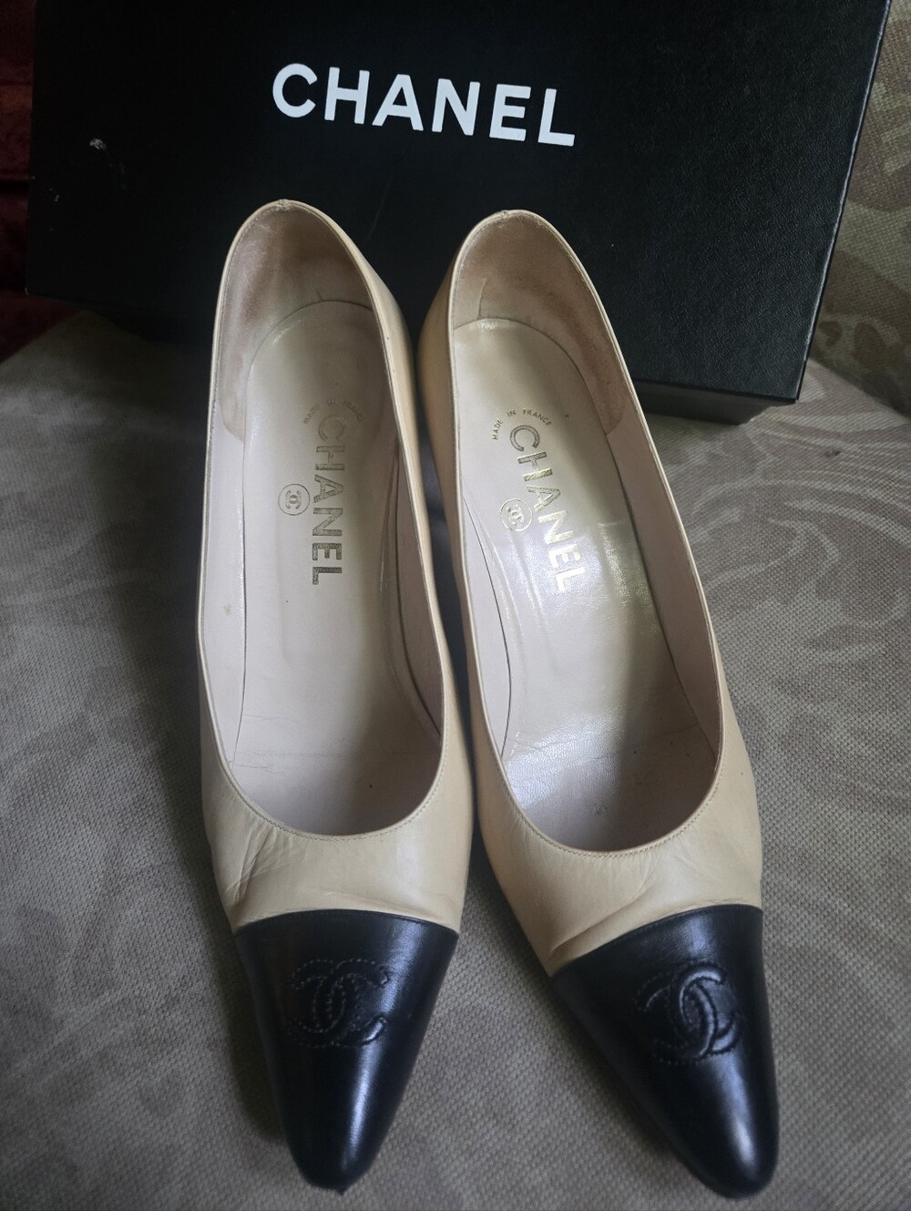 CHANEL Chic Two-Tone Beige and Black Cap-Toe Leather Pumps